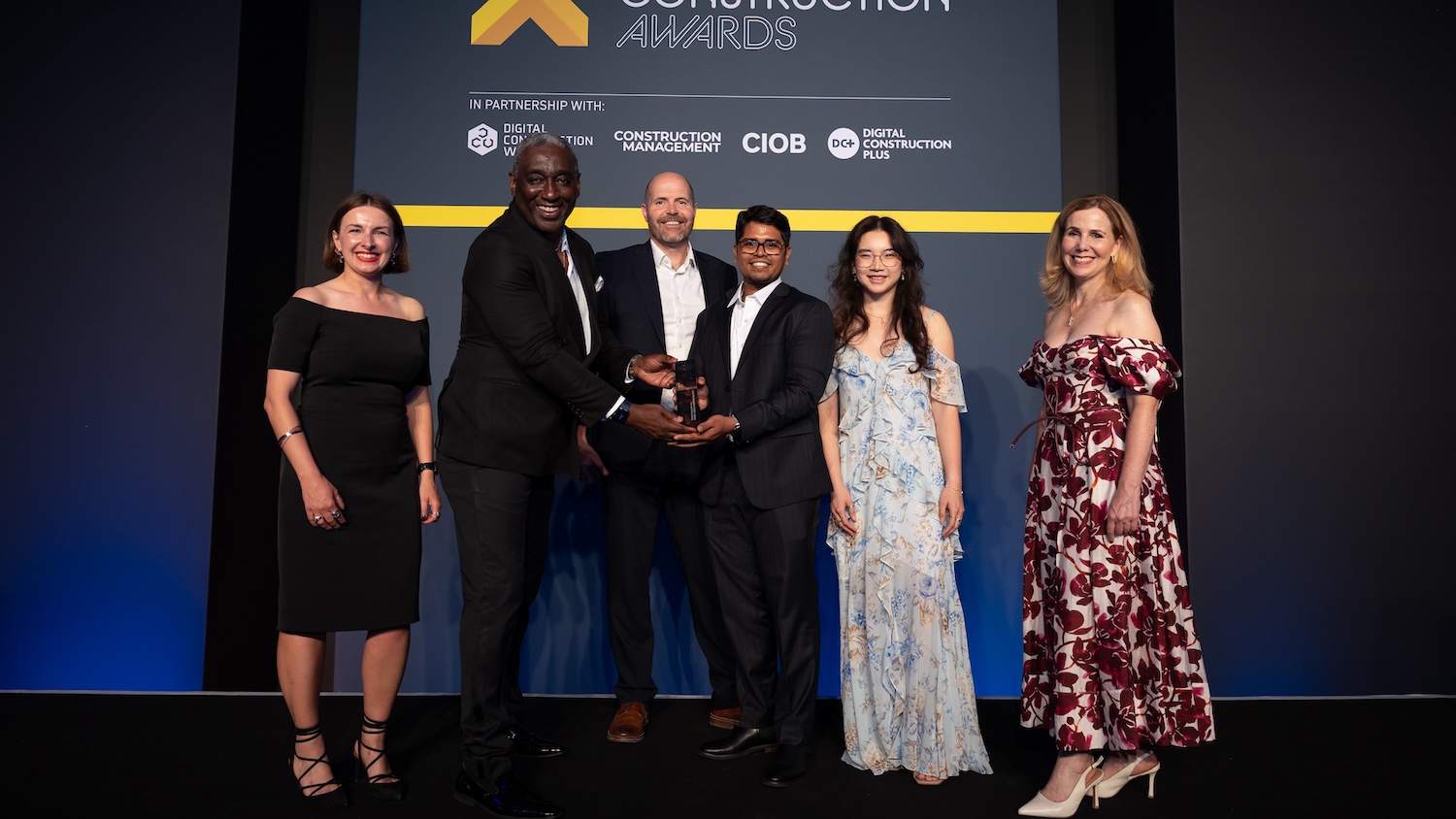 The Laing O'Rourke team collects their trophy from Karolina Orecchini of Digital Construction Week (far left), Dr Bola Abisogun of Digital Twin Skills Academy CIC (second left) and sally Phillips (far right)