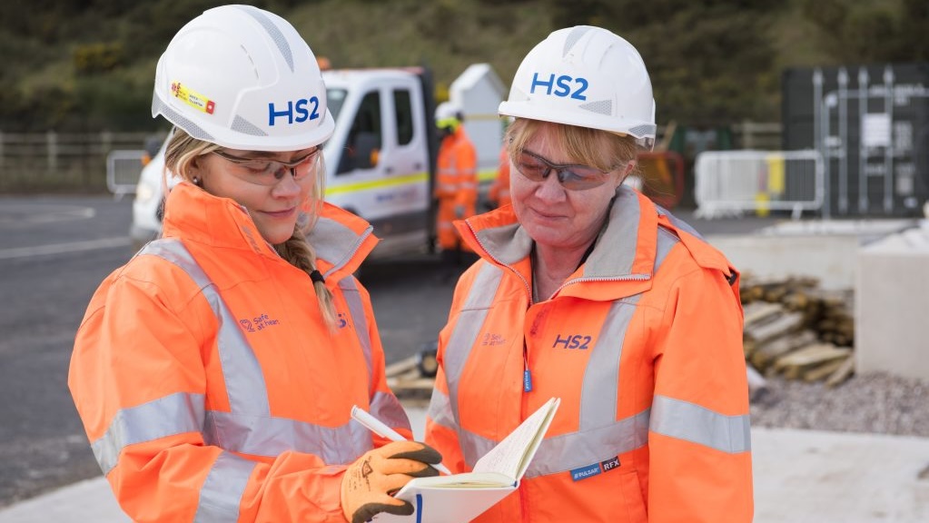 HS2 staff reviewing notes on site
