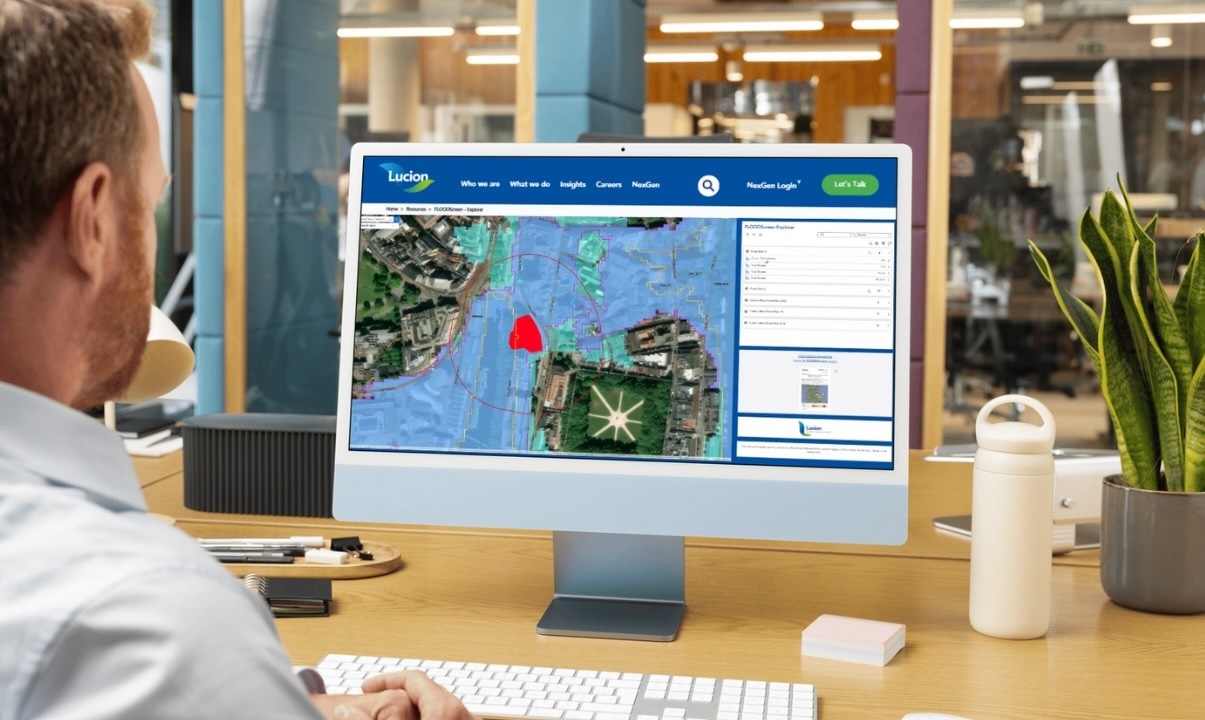 Photo of a person using FloodScreen Explorer for flood risk assessment